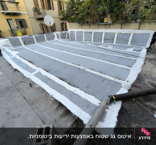 Roof with white sealing lines and pipes